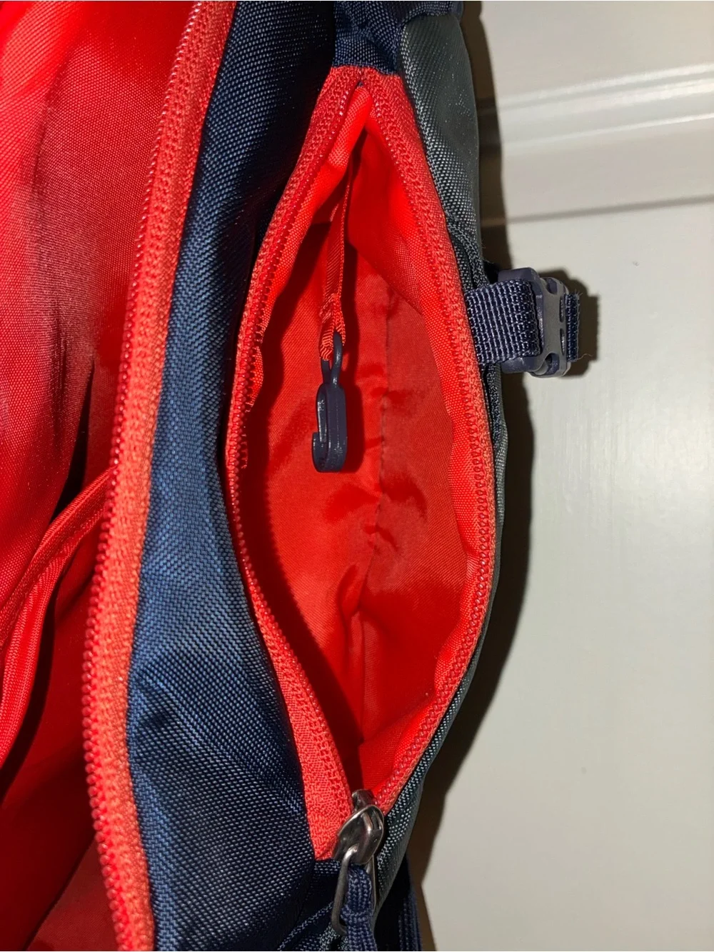 Patagonia Atom Sling 8L crossbody pack in a navy blue